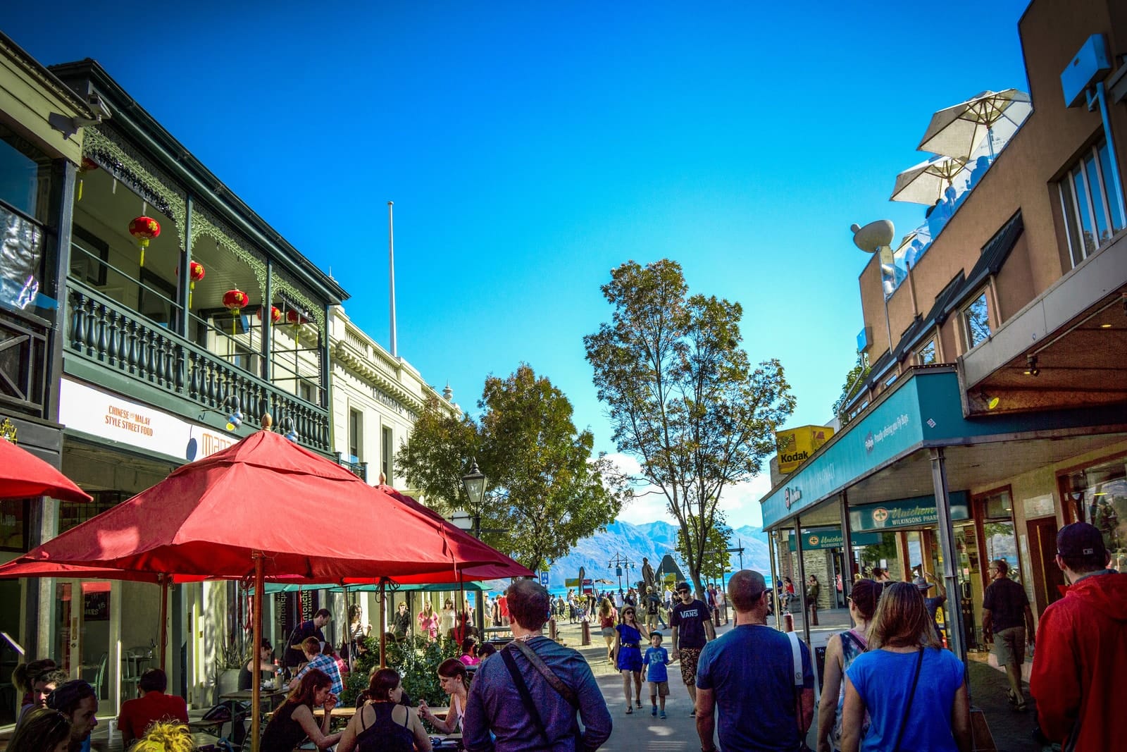 Shoppers and outdoor dining on a pedestrian street in central Queenstown