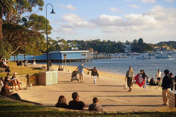 Visitors walking and relaxing beside the waterfront at Watsons Bay in Sydney